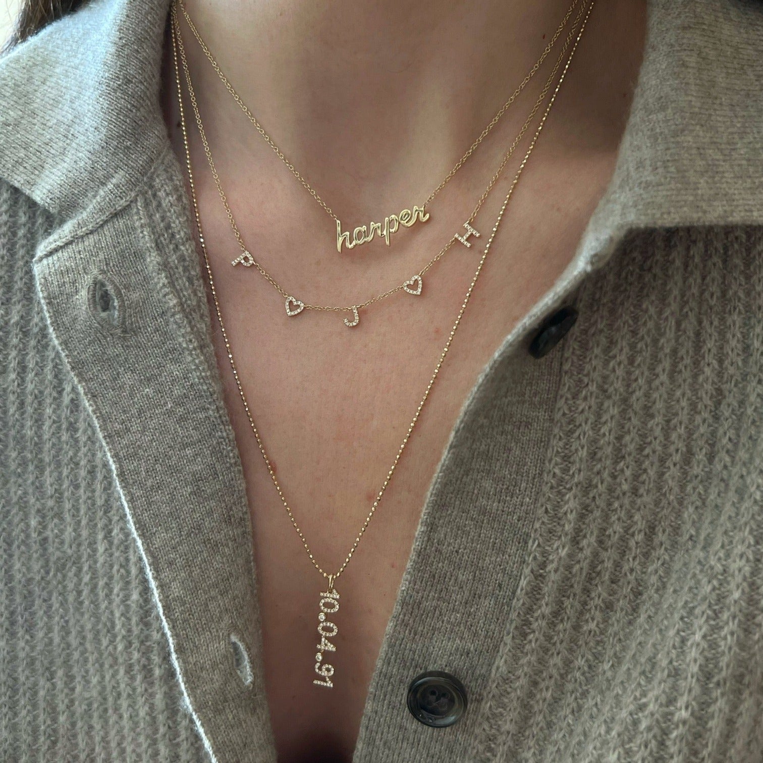 Script Gold Custom Initial Necklace on the neck 