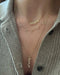 Script Gold Custom Initial Necklace on the neck 