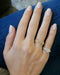 Diamond Script Name Ring on the hand in yellow gold