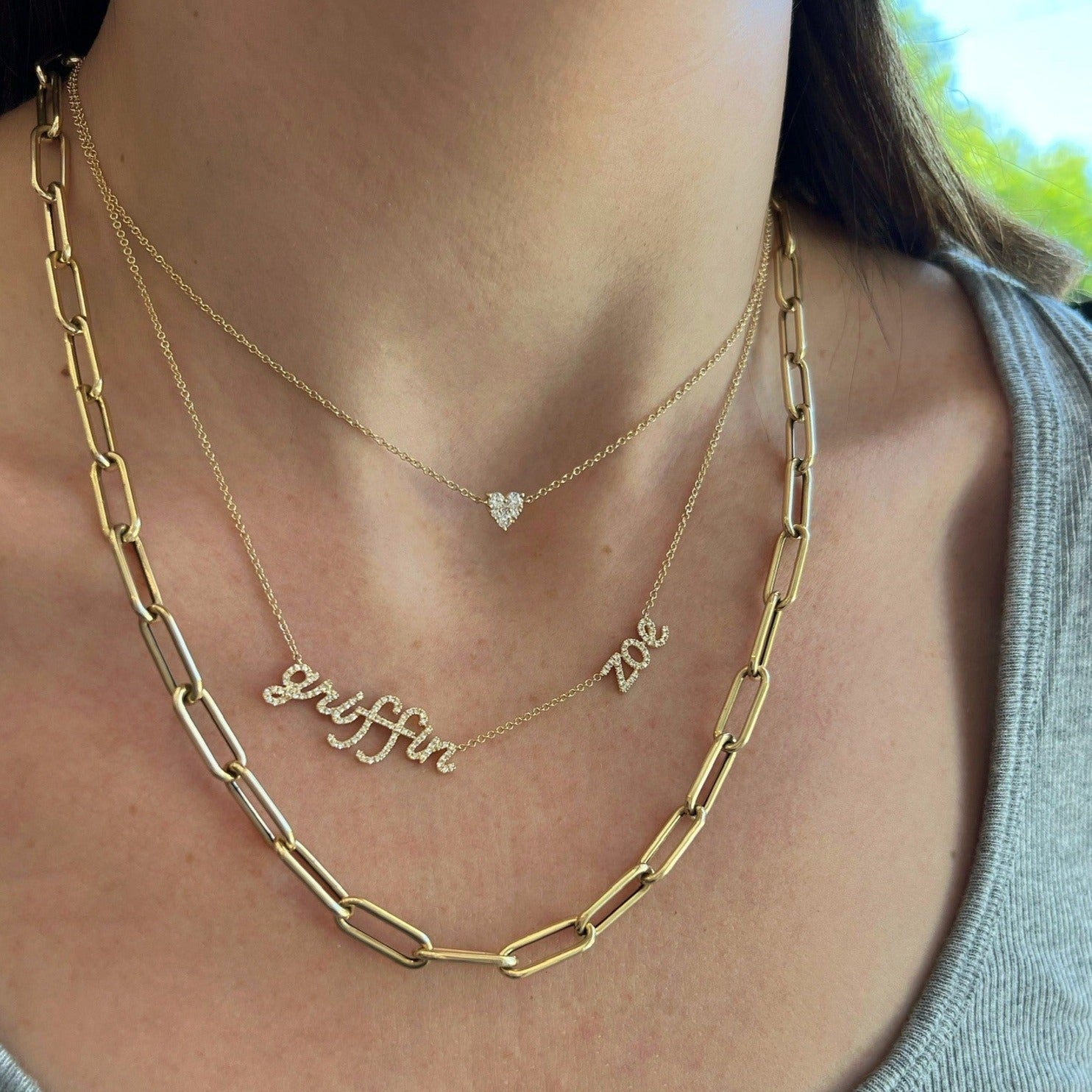 Jumbo Lola Chain Necklace And Triple Wrap Bracelet Styled on Neck of Model with Additional Necklaces to Show Length