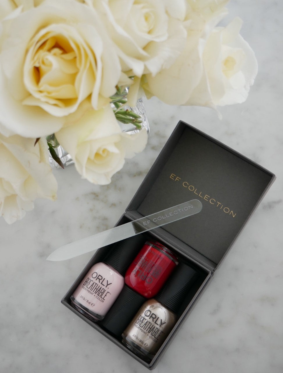 EFC Tempered Glass Nail File with EF Collection box and ORLY nail polish in red, light pink, and metallic