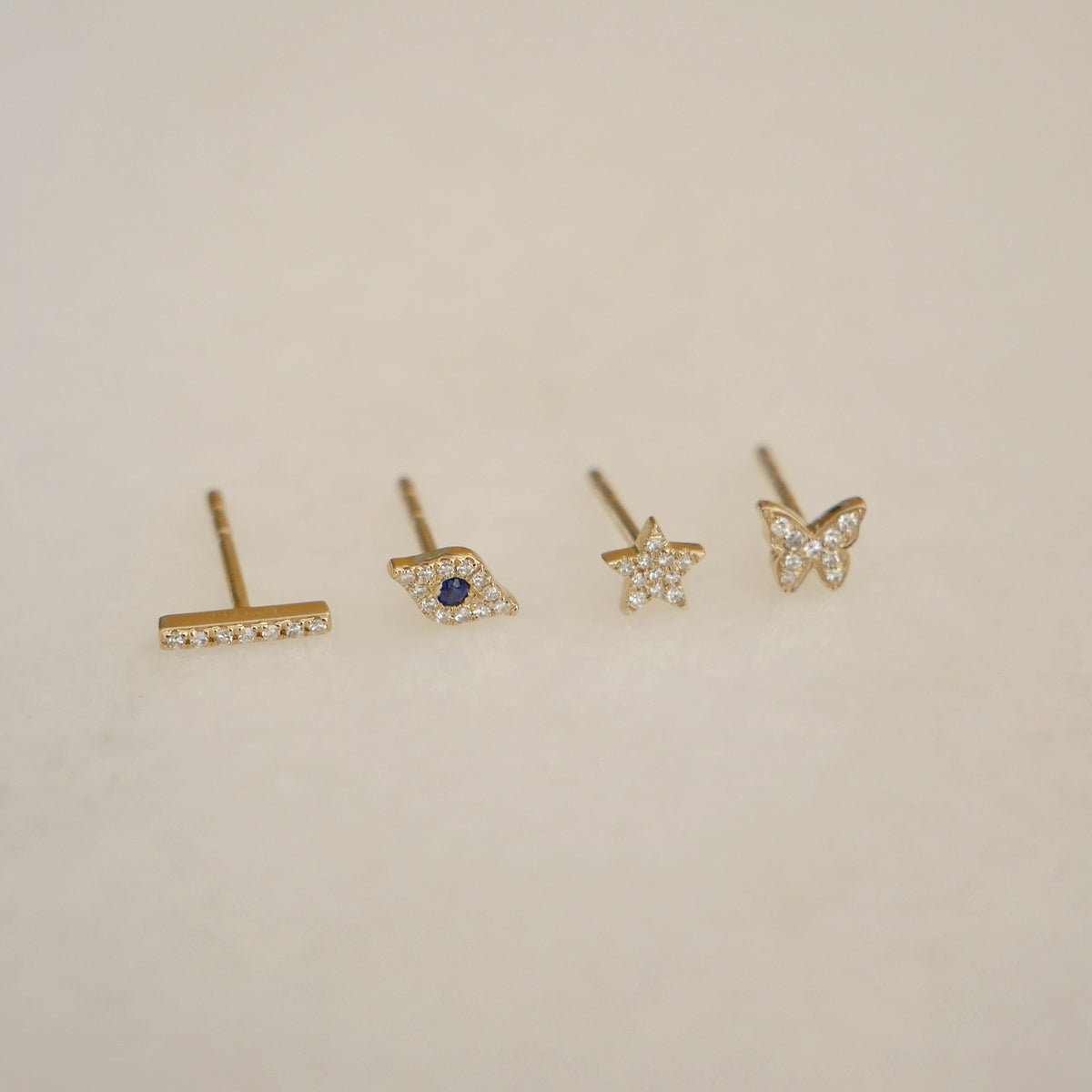 The Single Studs Gift Set in 14k Yellow Gold Laying Flat on Table