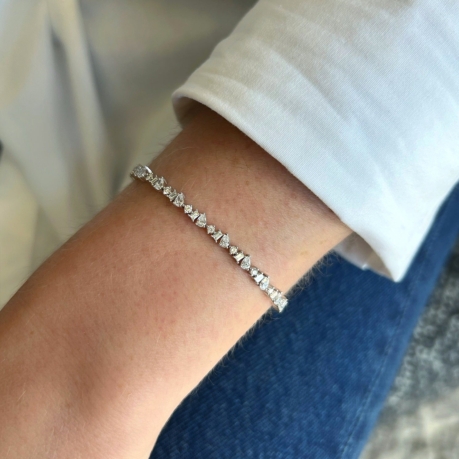 Diamond Multifaceted Eternity Bracelet in 14k yellow gold styled on wrist of model