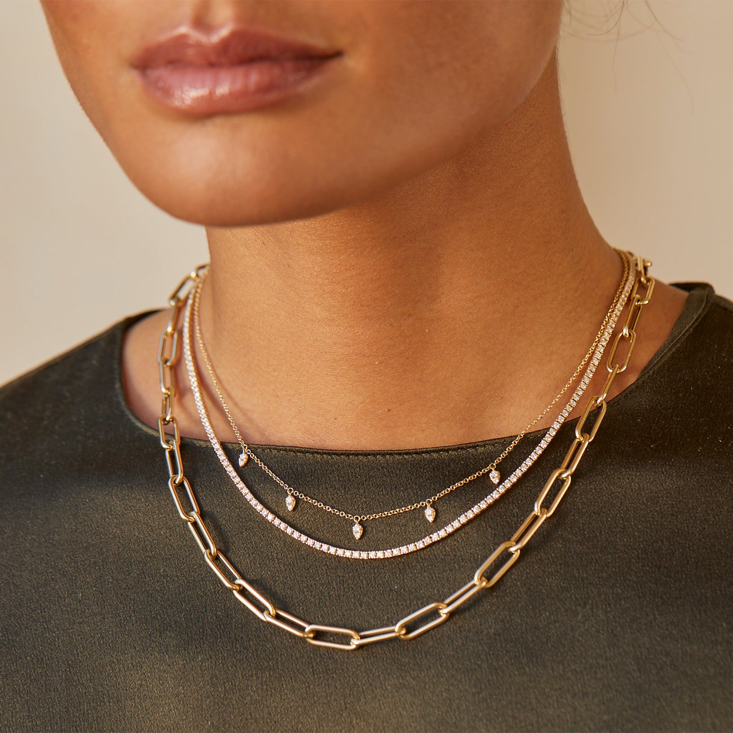 Diamond Grace Necklace styled on neck of model with layered necklaces and model in black blouse