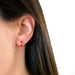 Diamond & Crimson Enamel Huggie Earring in 14k yellow gold styled on ear lobe of model