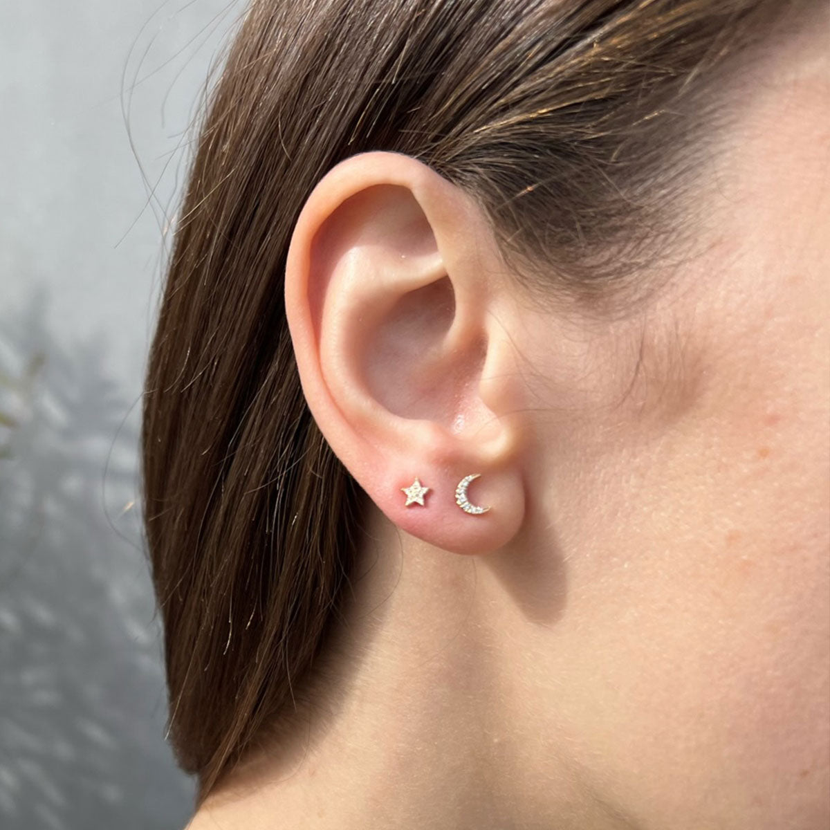 The Celestial Set in 14k Yellow Gold - 1 Diamond Mini Moon Stud & 1 Diamond Star Stud Styled on Ear