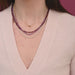 Gold Heart and Diamond Arrow Necklace in 14k Yellow Gold Styled on Neck of Model with Birthstone Bead Necklaces Layered