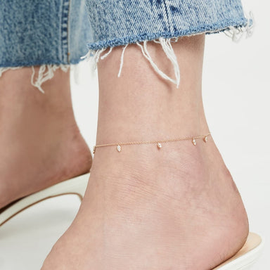 Diamond 5 Mini Teardrop Chain Anklet on the ankle in yellow gold