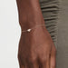 Diamond Heart Chain Bracelet in 14k Yellow Gold Styled on Wrist of Model