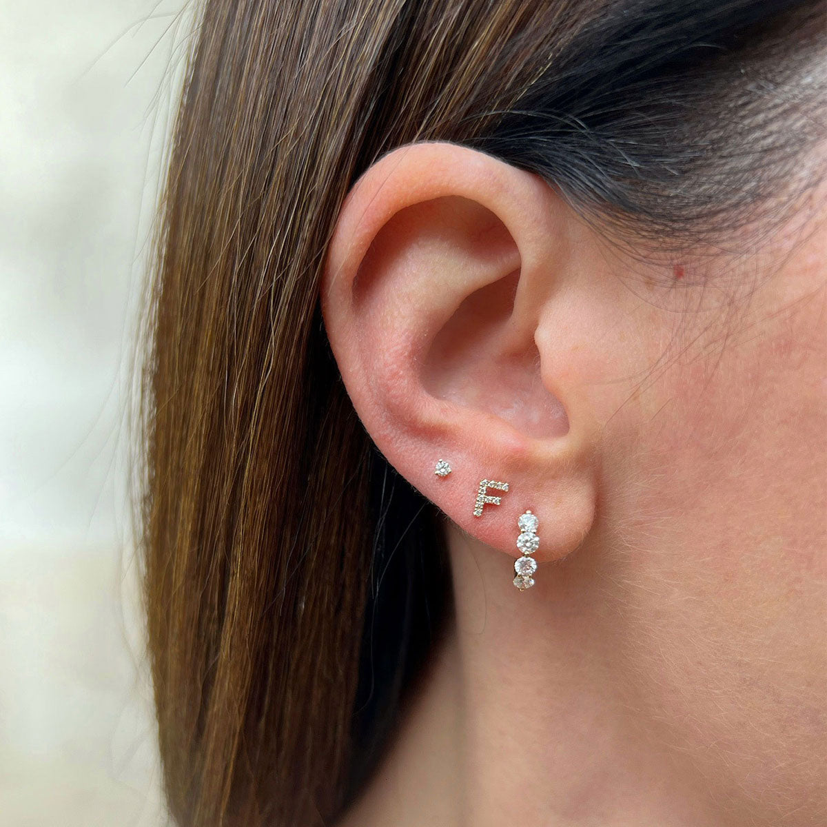 The Initial Set in 14k Yellow Gold Styled on Ear with F Initial Stud