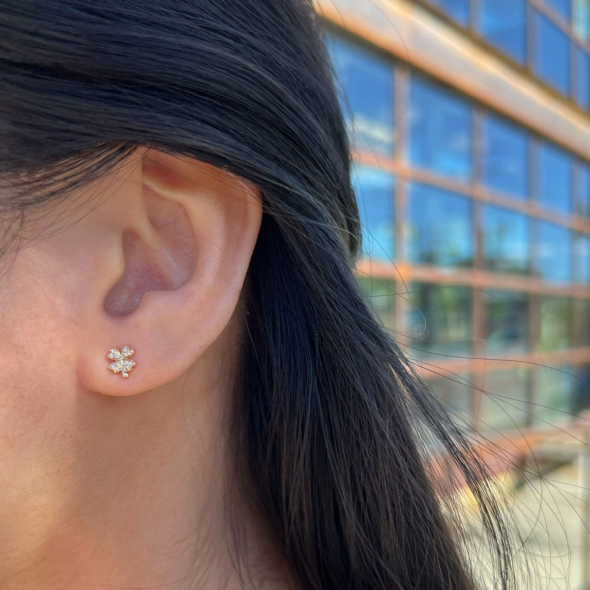 Clover Stud in 14k yellow gold styled on ear